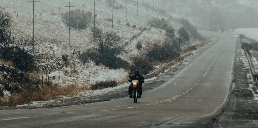 person riding motorcycle on icy road